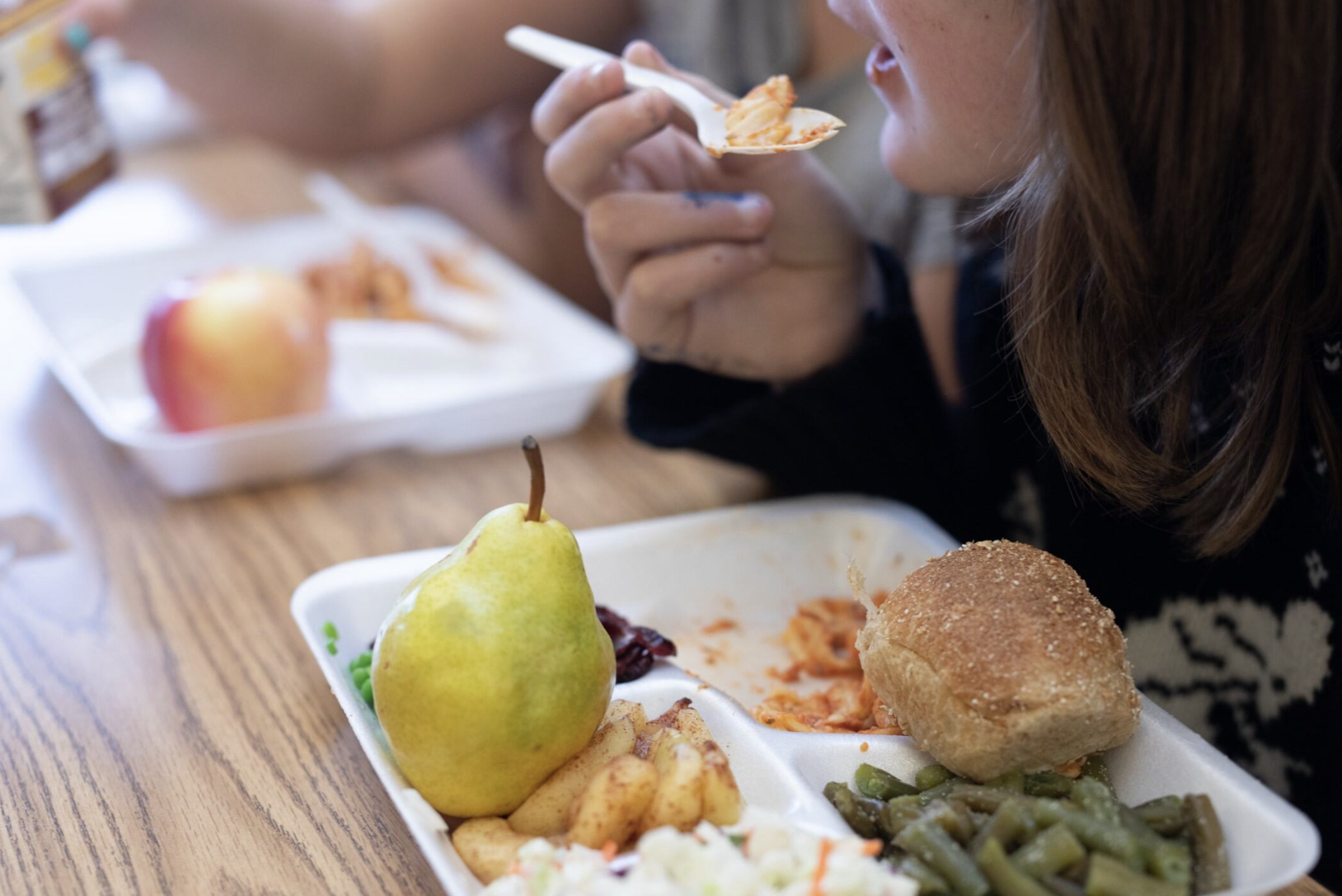 A child eats a school lunch